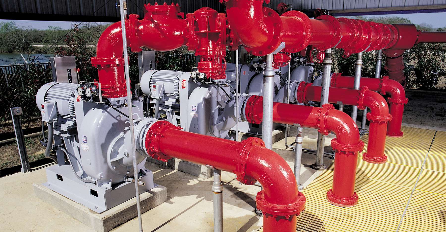 Gorman-Rupp self-priming pumps with red piping and motors, designed for efficient seawater pumping solutions at Daydream Island Resort.
